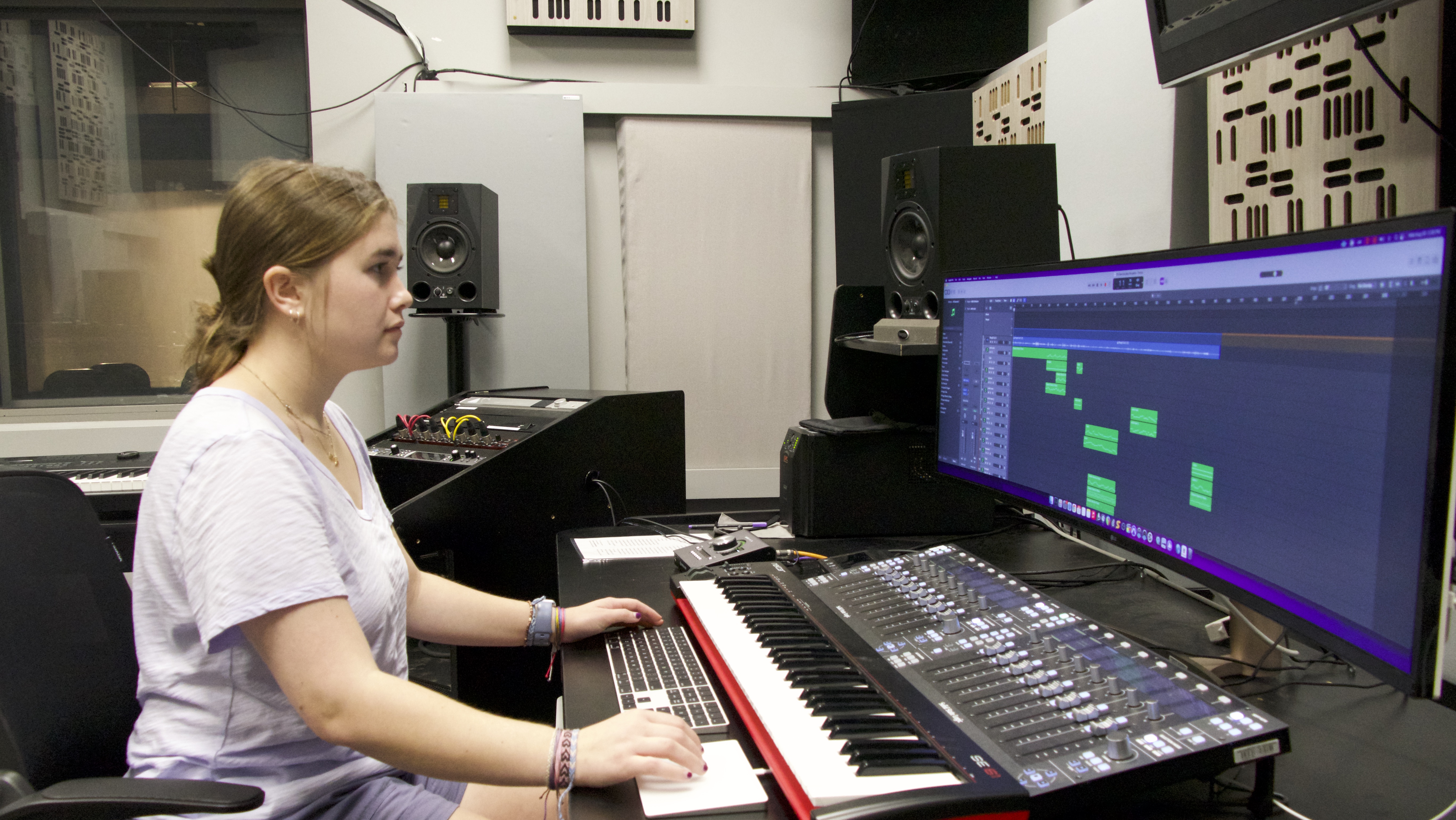 Film and Composition Certificate student Gianna Dimuzio in the Dancz Center for New Music working on one of her compositions.