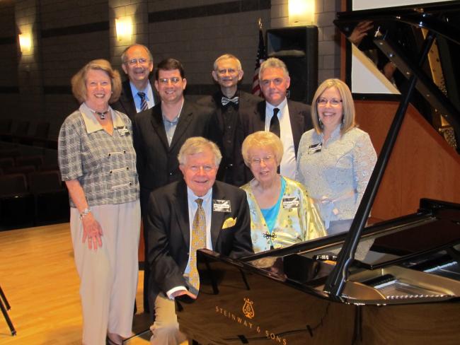 Faculty and donors by the new Steinway