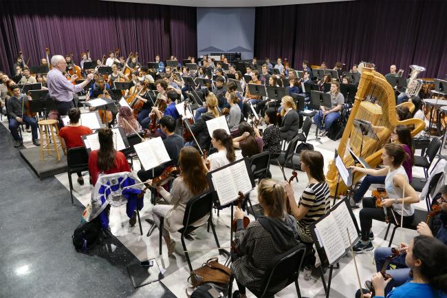 The UGA Symphony Orchestra, conducted by Mark Cedel, rehearses at the Performing Arts Center on Feb. 24.