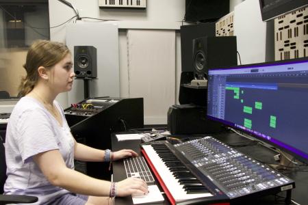 Film and Composition Certificate student Gianna Dimuzio in the Dancz Center for New Music working on one of her compositions.