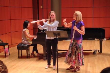 Carol Wincenc, professor of flute at The Juilliard School, instructs a student during Flutissimo 2014 in Ramsey Concert Hall.