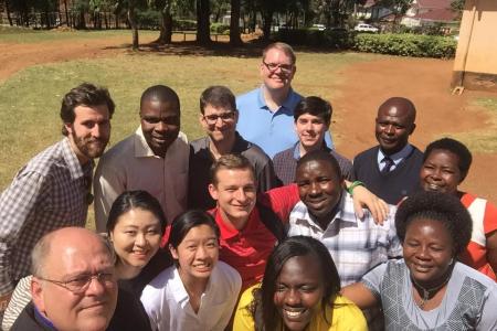 UGA faculty and students, led by Dr. Skip Taylor (bottom left) and Dr. Pete Jutras (third row, third from left), share a photo with faculty and staff of Potters House Elementary School in Kenya.