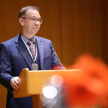 Daniel Ellis accepting the Hendrix College Odyssey Award.