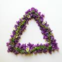 Triangle of flowers that are purple and green